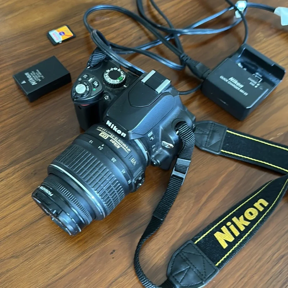 Nikon D60 digital camera with 4GB memory card, lens, battery, & charger included